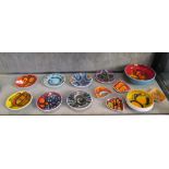 Seven Poole Pottery Delphis circular dishes, 13 cm diameter, each with painters mark, (two cracked),