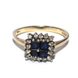 A 9 carat gold ring set with blue stones and small diamonds