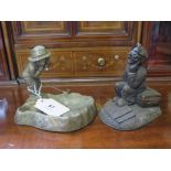A bronze finish study of 'Old Bill' seated on a suitcase, 11 cm high, and another of an amusing