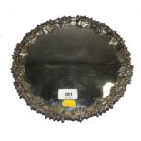An Edwardian silver salver, with gadrooned shaped rim, engraved Pearce & Sons, Silversmiths,