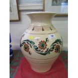 A large glazed terracotta pot with hand painted floral decoration, 34 cm high