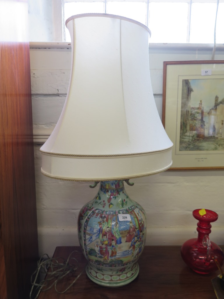 A Chinese famille vert vase, converted to a table lamp, depicting court scenes, with restoration, 41