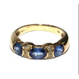 A sapphire and diamond ring set in 9 carat gold