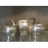 A three piece silver tea set, of baluster form, JS&S maker's mark, Birmingham 1914, teapot 13.5 cm