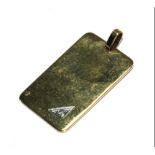 A 9 carat gold pendant plaque set with a small diamond