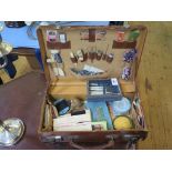 A cased set of Edwardian ivory button hooks and accessories, and a case of sewing items including