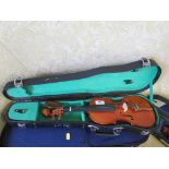 A Stentor Student child's violin, a Chinese child's violin, and another child's violin, each