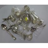 A collection of mixed silver tea and coffee spoons and a small silver dish