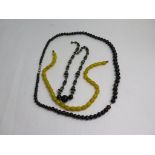 A collection of three unusual vintage bead necklaces