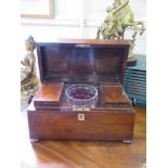 A Regency rosewood sarcophagus form tea caddy, with two lidded compartments and a later mixing bowl,