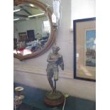 A brass figural table lamp, depicting a man in lion skin, on a rosso marble base, 51 cm high