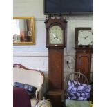 An early 19th century oak cased longcase clock, the swan neck pediment over an arched painted dial