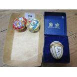 A Halcyon Days enamel 1984 Easter egg pill box, in box, and two others, 'A Year To Remember' and