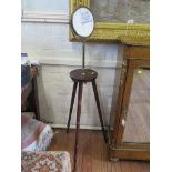 A Victorian stained wood gentleman's shaving stand, with hinged bevelled circular plate, on a