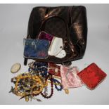 A collection of costume jewellery to include a butterfly wing brooch and some Chinese silk purses