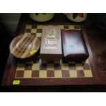 A Staunton chess set and board together with two miniature travelling chess sets