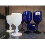 A pair of Fenton hobnail milk glass wine goblets 15 cm high, a Bristol blue glass rinser bowl and