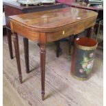 A Regency mahogany and line inlaid foldover tea table, with tablet frieze and reeded tapering