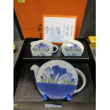 A Bizarre by Clarice Cliff Wedgwood 'Bonjour' three piece tea set, with Blue Crocus design, teapot