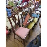 A pair of Edwardian stained wood and ivorine inlaid salon chairs, the carved backs inlaid with