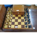 A turned wood and weighted chess set by Jaques of London, king 9 cm high, with veneered board, 45 cm