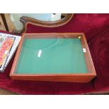 A table top display case, with sloping glazed top, 61 x 46 cm