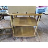 An Ercol light elm and beech tea trolley, and an Ercol light elm and beech square side table, 69