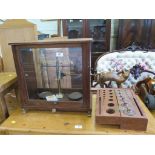 A set of laboratory balances, by Baird & Tatlock, No. 3938, case 47 cm wide and a cased set of