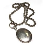 A silver locket on metal chain