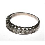 An eleven stone half eternity ring set in white colour metal