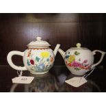 Two reproduction small porcelain teapots depicting designs in the Victorian and Albert museum, one