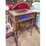 An Edwardian mahogany and crossbanded satinwood bijouterie table, the rectangular hinged top over