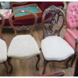 Two Victorian salon chairs, one with cabochon and scroll carved oval back, the other with carved