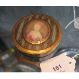 A 19th century French papier mache and tortoiseshell powder box, the lid mounted with a painted