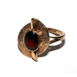 A 9 carat gold ring set with garnet