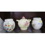 A Royal Staffordshire Ceramics by Clarice Cliff two handled sugar bowl with lid, decorated with pink