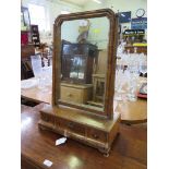 A George II style walnut toilet mirror, the hinged plate over a base with three moulded drawers on