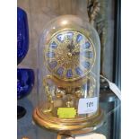 A Kieninger & Obergfell anniversary clock, fitted with glass dome, total height 16.5 cm high