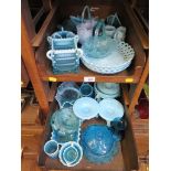 A collection of Victorian and later blue pressed glass wares, including baskets, dishes, and vases