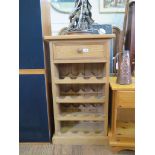 A pine wine rack, with frieze drawer, 50 cm wide, 90 cm high