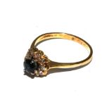 An 18 carat yellow gold ring set with diamonds and sapphires