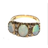 A five stone opal and diamond ring in 9 carat gold