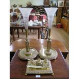 A late Victorian copper and gilt metal desk set comprising an ink standish, with strapwork and