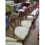 A set of six early Victorian walnut dining chairs, the trefoil interlaced backs on moulded