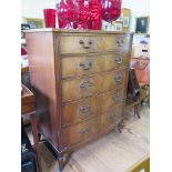 A George III style mahogany bow front chest of drawers, with five long graduated drawers, on