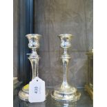 A pair of silver waisted candlesticks, Chester 1927, 15.5 cm high