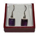 A pair of paste set Sterling silver earrings and a pair of amethyst earrings, both cased