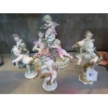 A group of four 'Naples' putti figures, depciting the four seasons, 15cm high, another similar