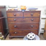 An early Victorian crossbanded mahogany chest of drawers, with two short and three long graduated