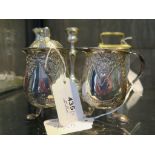 A mustard pot on three feet and a matching jug, both marked 800 standard silver